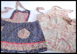 A pair of non matching vintage style pinefore / ap