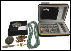 A group of vintage costume jewellery to include a jade type malacite necklace , gold tone metal