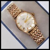 A vintage Rone 9ct gold watch having a 25 jewel movement. The silvered dial having gilt baton