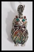 A sterling silver plique a jour pendant in the for