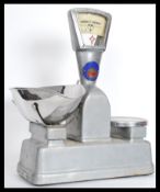 A set of vintage 20th century Industrial Vandom and Hart enamel weighing scales along with a set