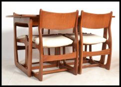 A vintage retro 20th Portwood Furniture teak Danish Influence table and set of four dining chairs.