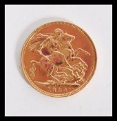 A Queen Victoria 1894 gold sovereign coin with old Bust Front, St George & Dragon verso. Total