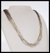 A good contemporary Liquid Silver Company ladies multistring necklace choker in silver with clasp in