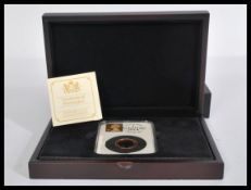 Gold Sovereign - A 2014 Tower Hill gold sovereign coin within capsule case complete with
