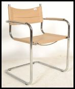 A retro style chrome cantilever dining chair with