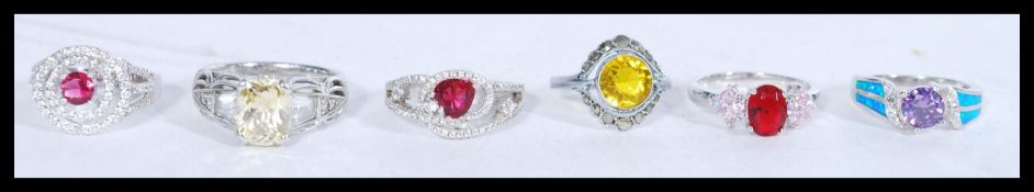 A collection of 6 925 silver rings set with various stones. Marked 925. Weight approx 26g.