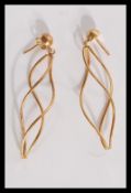 A pair of 14ct gold designer drop earrings of twis