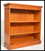 An early 20th century Yew wood bookcase being open fronted with multiple shelves. Please see images.