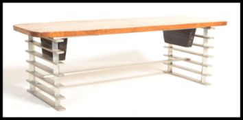 A retro mid century elm and chrome coffee table. Raised on a tubular metal chrome frame of angular