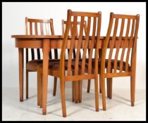 A vintage retro 20th century teak dining suite of