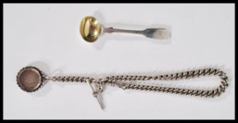 A heavy silver hallmarked Albert chain having a T bar clasp and coin pendant. Along with a Victorian