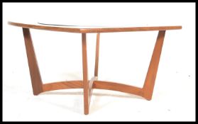 A vintage retro 20th century teak space age sputnik atomic style coffee table of oblong form