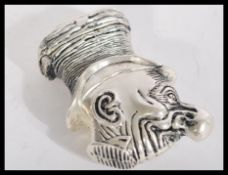 A silver plated novelty vesta case in the form of