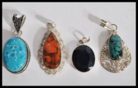 A collection of  4 925 silver necklace pendants being set with various sones in elaborate