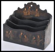 An early 20th century Japanese letter rack stationary tidy depicting figures with trees and