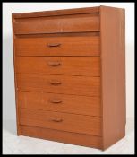 A 1970's retro teak wood upright chest of drawers