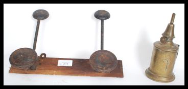 A 19th Century French brass Lampe Pigeon garantie