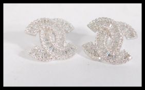 A pair of sterling silver and marcasite earrings h