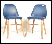 Two vintage 20th century beech wood chairs having