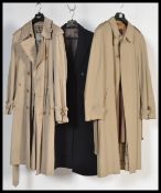 A retro gent's 1980’s Aquascutum men’s trenchcoat. Size Large together with a Simpson of