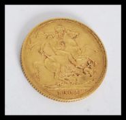 An Edward VII 1904 full sovereign coin, St George & Dragon Obv.  Sovereign weighs 7.98 grams.