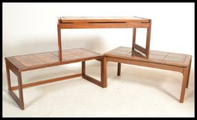 A collection of three Scandinavian retro teak wood