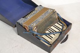 Musical Instruments. A vintage early 20th century Paulo Antonio piano accordion in faux marbled