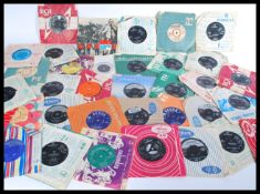 A group of vintage 1960's 45rpm vinyl record singles including The Beatles , The Rolling Stones ,