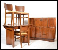 A vintage mid 20th century Art Deco Revival walnut cocktail cabinet suite along with a similar table