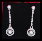 A pair of sterling silver opal and CZ drop earring