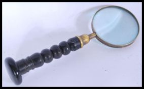 A vintage early 20th century large brass magnifyin