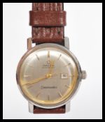 A vintage 20th century Omega Seamaster automatic wrist watch having a silvered dial with gilt