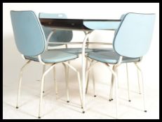 A vintage retro 20th century 1960's set of blue formica kitchenette table and four chairs raised