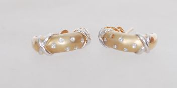 A pair of 9ct gold diamond earrings having white g