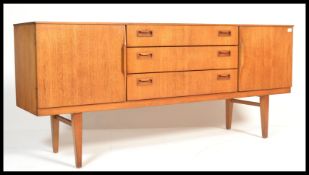 A vintage mid century teak wood sideboard, cupboar