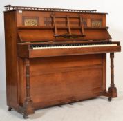 A Victorian Arts & Crafts mahogany and brass uprig
