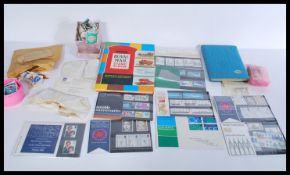 A group of vintage stamps loose and in albums. Two