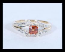 A hallmarked 9ct gold ing set with a central squar