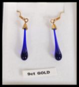 A pair of 9ct gold Bristol Blue glass drop earrings complete in presentation jewellery box. Weighs