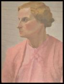 An early 20th century oil on canvas portrait study of a lady in period pink dress of the time. The