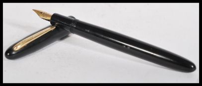 A vintage Edacoto Bachelor Pulseur fountain pen having an 18ct gold nib.