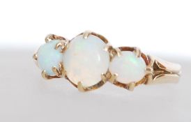 A hallmarked 9ct gold three stone opal ring set wi