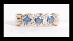 A hallmarked 9ct gold blue and white stone ring ha