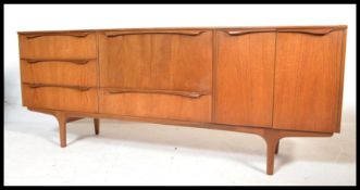 A vintage retro 20th century teak sideboard by Sutcliffe of Todmorden raised on tapered supports