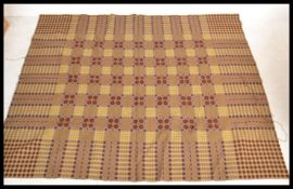 A vintage 20th Century traditional Welsh woollen carthen type fringed blanket with geometric