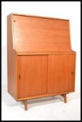 A vintage retro 20th century Herbert Gibbs teak wood bureau from the Autographed Furniture range.