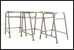 A vintage set of lab stools in grey finish with tu