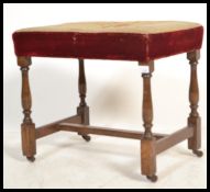 A late 19th century oak tapestry upholstered eccle