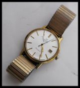 A vintage 20th century Omega Geneve 1970's gents wrist watch having a silvered dial with gilt